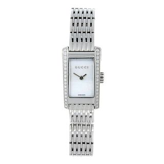 GUCCI - a lady's 8600L bracelet watch. Factory diamond set stainless steel case. Numbered 15178. Uns