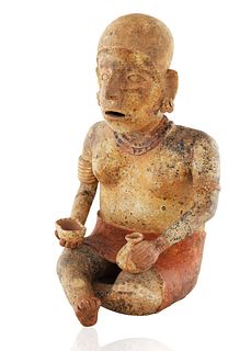 A JALISCO SEATED FIGURE OF A WOMAN