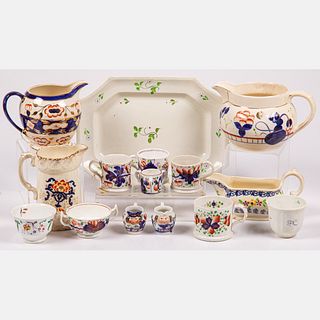 Fifteen English Gaudy Ironstone Pitchers, Cups, and Platter
