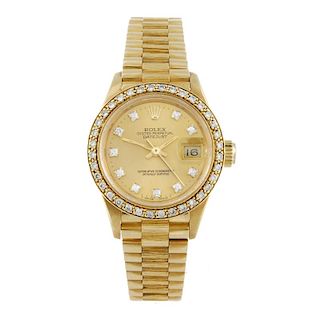 ROLEX - a lady's Oyster Perpetual Datejust bracelet watch. Circa 1985. 18ct yellow gold case with di