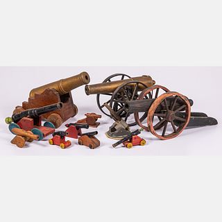 Eleven Metal and Wood Toy Cannons
