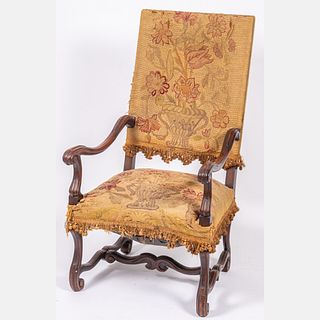 A Louis XIV Style Carved Walnut Armchair