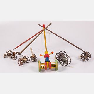 Eight English and American Metal and Wood Bell and Push Bell Toys