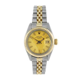 ROLEX - a lady's Oyster Perpetual Date bracelet watch. Circa 1982. Stainless steel case with yellow