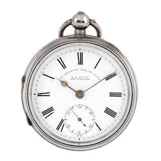 An open face pocket watch by W.E Watts. Silver case with engraved cartouche and engraved inner cover