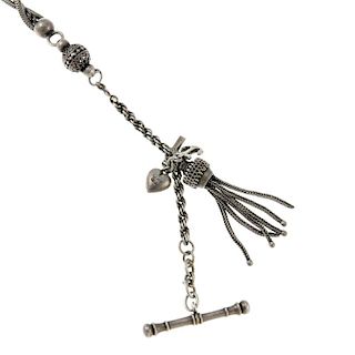 A white metal Albertina chain with T-bar, three charms and tassel fob. 22.5cm. Together with a white