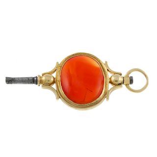 A yellow metal pocket watch key set with a carnelian. 49mm. 7gms. <br><br>Displays scratches, marks