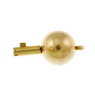 A yellow metal pocket watch key, in the form of a ball. 18mm. 14gms. <br><br>Ball displays light to