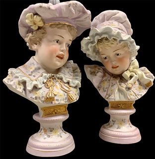 Lot of 2 lovely boy and girl decorative bisque busts, tallest @ 11". Painted in lavender with gold accents, matched set.