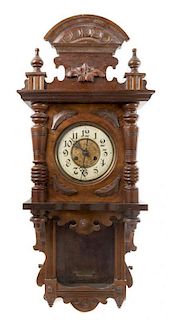 A Victorian Walnut Regulator Clock Height 37 inches.