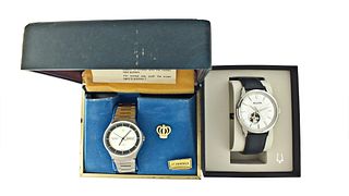 A lot of two men's wrist watches with boxes