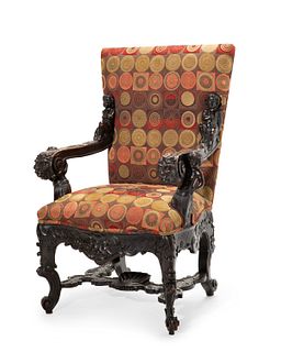 A large Horner-style carved wood armchair