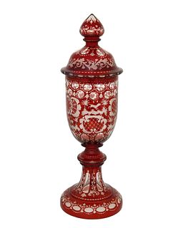 A Bohemian cut-glass lidded vase