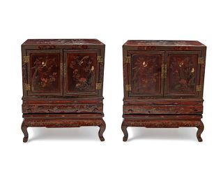 A pair of Chinese carved wood cabinets