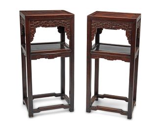 A pair of Chinese carved wood stands