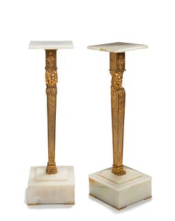 A pair of French Empire-style gilt-bronze and marble pedestals