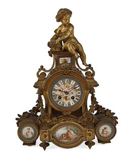 A French gilt-bronze and porcelain mantle clock