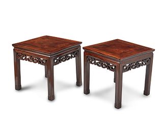 A pair of Chinese hardwood lamp tables