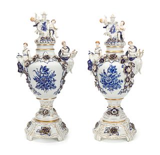 A pair of white and blue porcelain urns