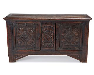 A Renaissance-style carved oak cabinet