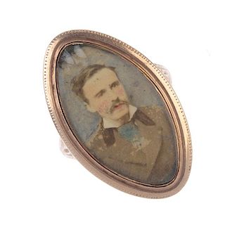 A late Georgian gold memorial ring with later added miniature portrait. Of marquise-shape outline, t