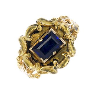 A late Georgian 18ct gold composite ring. The rectangular blue stone to the acanthus surround and sh