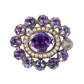 A late 19th century amethyst and split pearl mourning brooch. The central oval-shape foil-backed ame