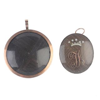 Two mid Victorian memorial pendants. The first of oval outline with monogram and seed pearl crown at