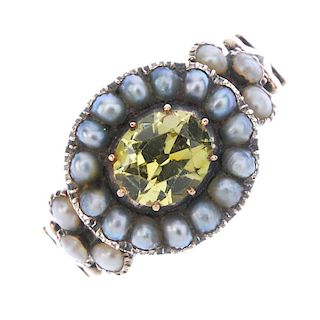 A mid Victorian gold chrysoberyl and split pearl ring. The centrally mounted gold chrysoberyl to the