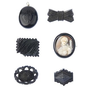 A selection of mainly late 19th century jet jewellery. To include a jet and shell cameo brooch, seve