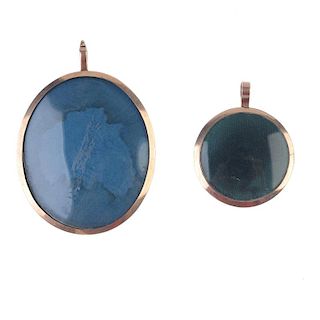 Two late 19th century 9ct gold photograph pendants. To include a circular-shape photograph pendant w
