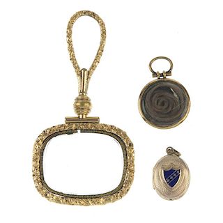 Three late 19th century items of jewellery. The first a magnifying glass, the rectangular glass with