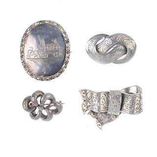 A selection of late 19th to early 20th century silver jewellery. To include a scroll embossed tapere