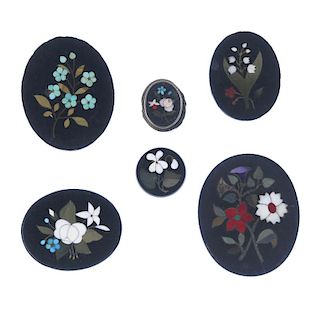 A selection of six pietra dura panels. To include an oval-shape pietra dura panel depicting forget-m