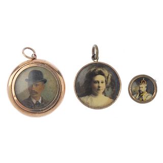 An early 20th century 9ct gold photograph locket and two others. The photograph locket containing a