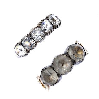 Two early 20th century gold and silver paste rings. To include a circular-shape foil-back colourless