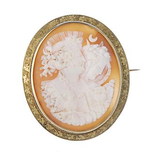 A shell cameo brooch depicting Night and Day. The shell with Night or Nyx and Day or Eos, with an ea