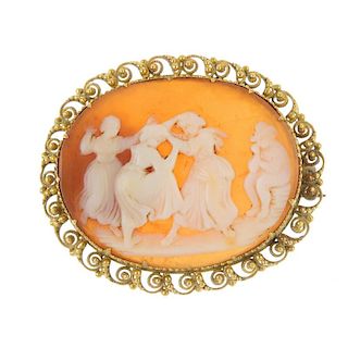 A shell cameo depicting ladies dancing. The three ladies with a man playing an instrument, to the sc