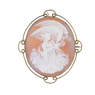 A shell cameo brooch depicting Hebe and Zeus. Hebe feeding Zeus, in the form of an eagle, from a bow