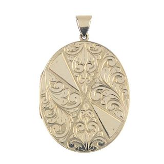 A 9ct gold locket. Of oval-outline, the front engraved in triangular panels with acanthus leaves, to