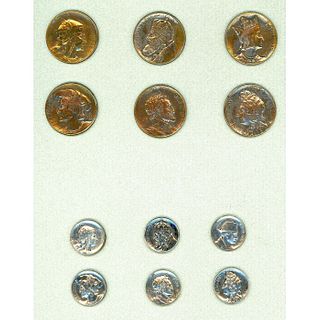 A SMALL CARD OF 2 SETS OF HEAD BUTTONS IN METAL