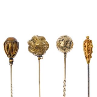 A selection of four mid to late 19th century stickpins. To include a scroll engraved stylised knot s