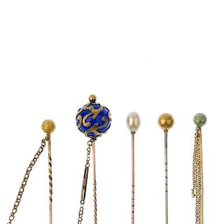 A selection of stickpins. To include a late 19th century blue paste orb stickpin, with overlaid scro