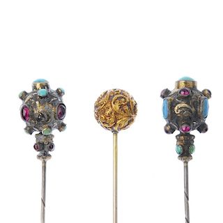 Three late 19th century hatpins. To include two similarly designed foil-back garnet, turquoise and b