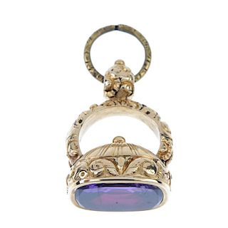A Victorian paste fob. The rectangular purple paste with curved corners, set to a pedestal with acan