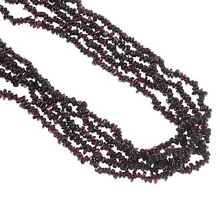 A selection of garnet jewellery. To include a bracelet, comprising twelve oval garnet cabochons coll