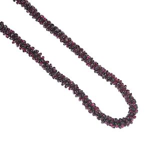 Three garnet necklaces. All designed as freeform beads threaded together to form a rope-style neckla