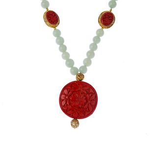 Two cinnebar and aventurine quartz  necklaces. The aventurine spherical beads with two cinnebar stat