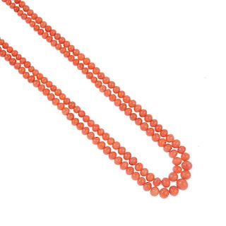A coral bead necklace. Comprising two strands of graduated coral beads, measuring 4.9 to 9mms, to th