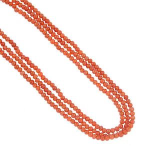 A coral necklace. Comprising three strands of coral beads measuring approximately 4mm, to the early